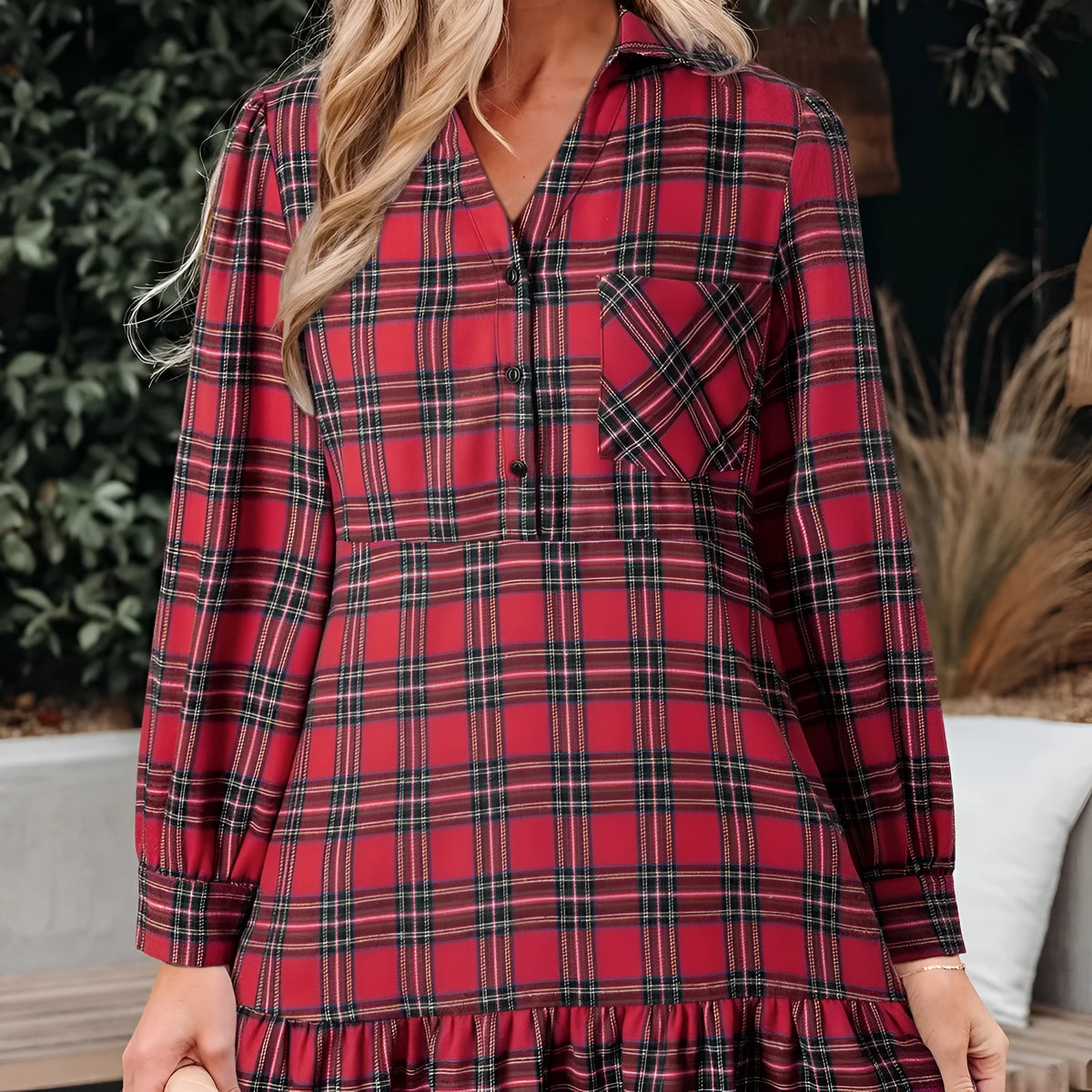 Red plaid mini dress with shirt collar, half buttons, long sleeves, and ruffle hem