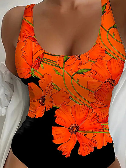 Orange flower print on a backless, slim fit one-piece swimsuit for swimming.