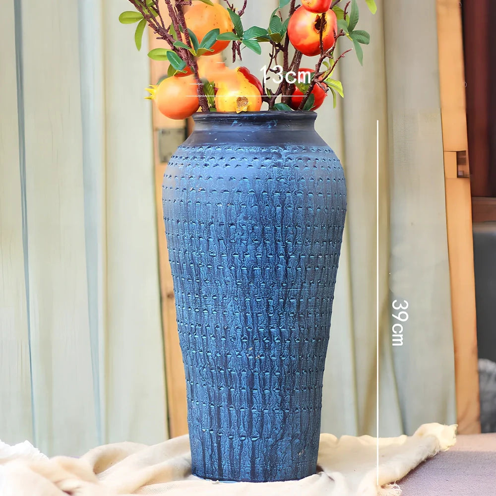 Ceramic mosaic vase with dried flower arrangement, handcrafted surface detailing