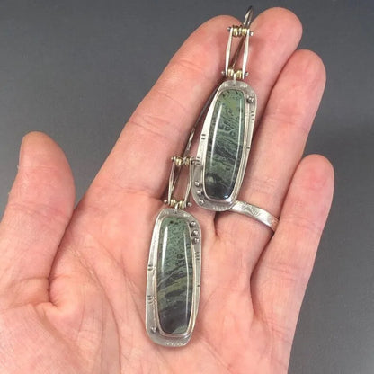 Two-tone geometric marble pattern alloy earrings with butterfly clasp, showing front and side views