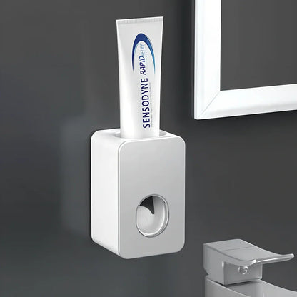 Black wall-mounted automatic toothpaste dispenser with 1 ml pump, punch-free adhesive, 18 cm height for bathroom use
