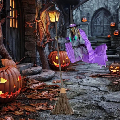 Floating witch Halloween decoration with broom, lifelike scary face, and purple hovering skirt
