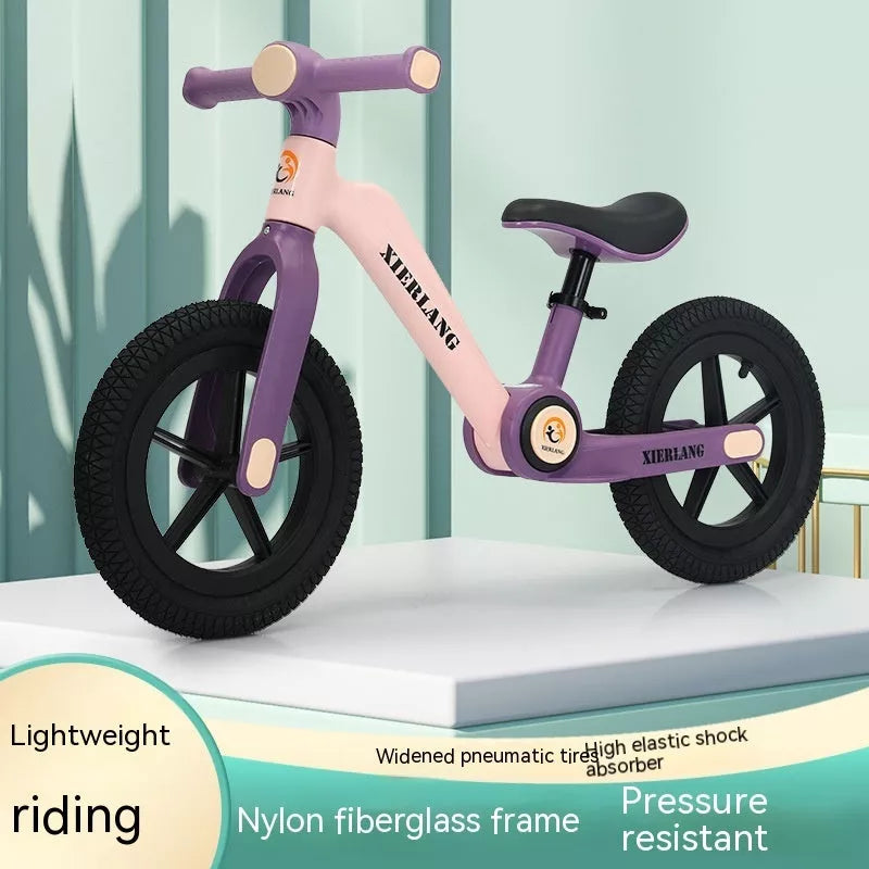 Foldable kids balance bike in grass green, light brown, or pink purple