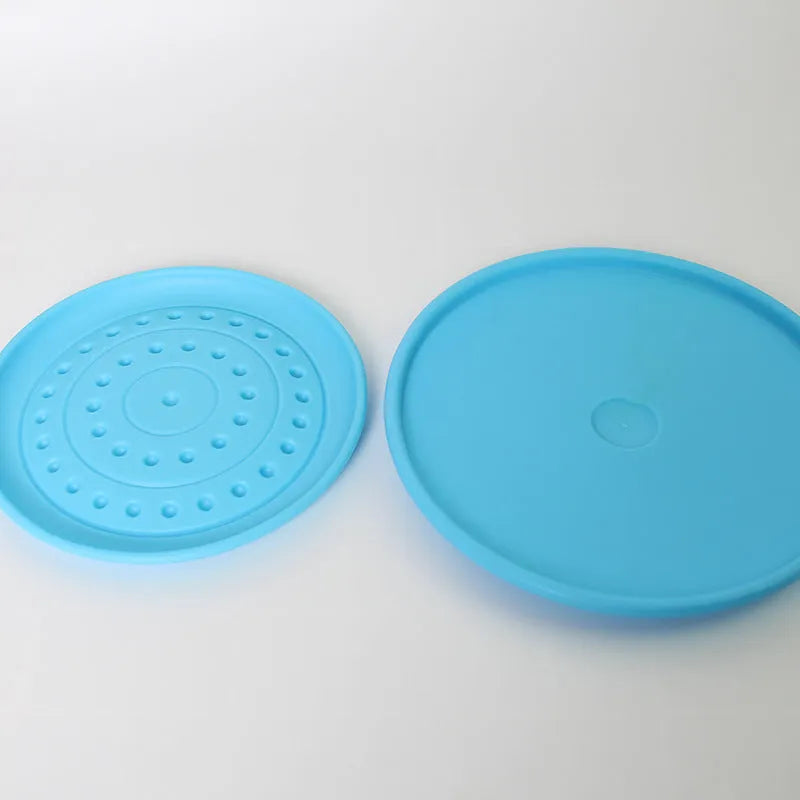 Plastic rubber Frisbee dog toy in green, large size, for outdoor fetch.