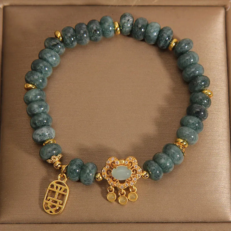 Women's natural emerald jade bracelet with abacus bead design and safety lock clasp