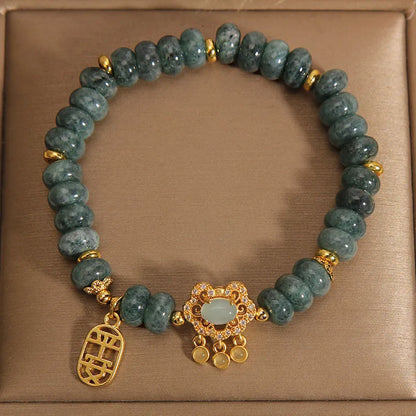 Women's natural emerald jade bracelet with abacus bead design and safety lock clasp