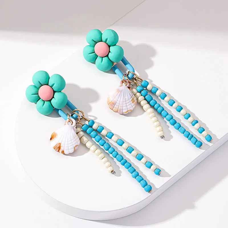 Handmade bohemian shell tassel earrings for women with colourful flower and geometric drop design