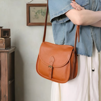 Genuine leather retro messenger bag with crossbody strap and flap closure in coffee colour