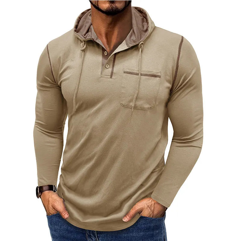 Man wearing a grey hooded henley long-sleeved t-shirt, showcasing the pullover style and cotton blend fabric.
