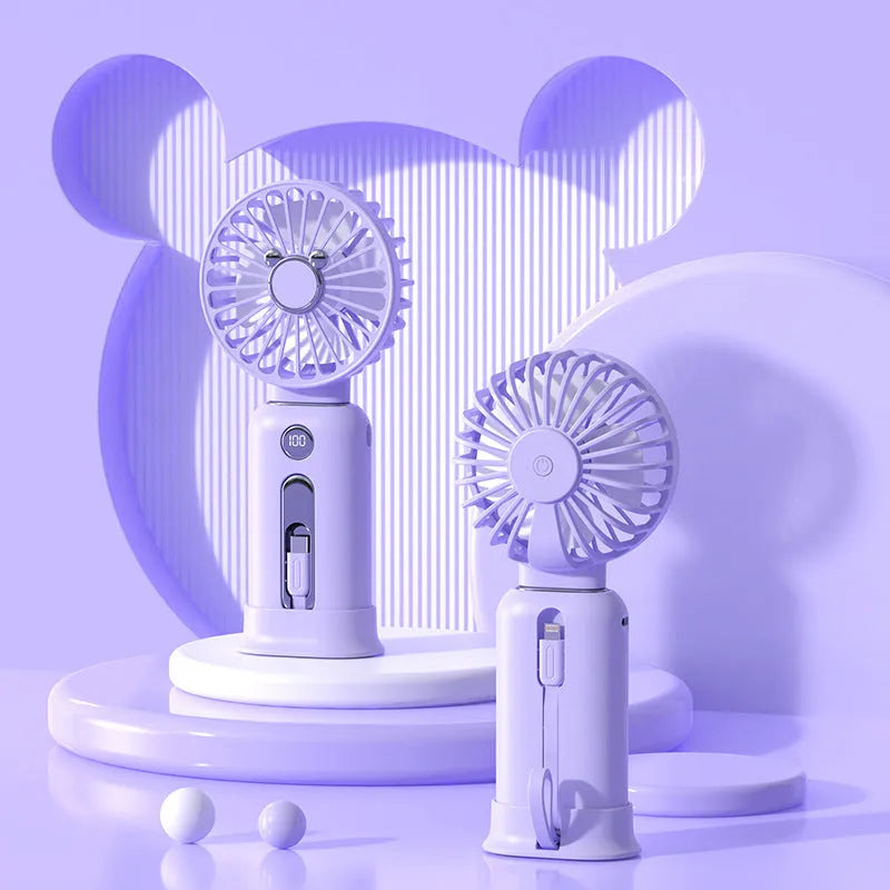 Purple handheld USB fan with power bank ports, shown with a white USB cable.