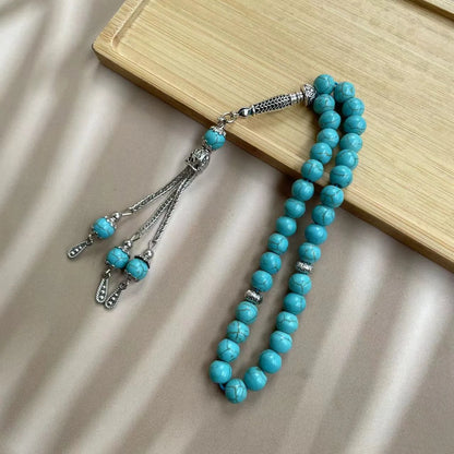 Sky blue stone bead Muslim prayer bracelet with 8mm beads on a single strand.