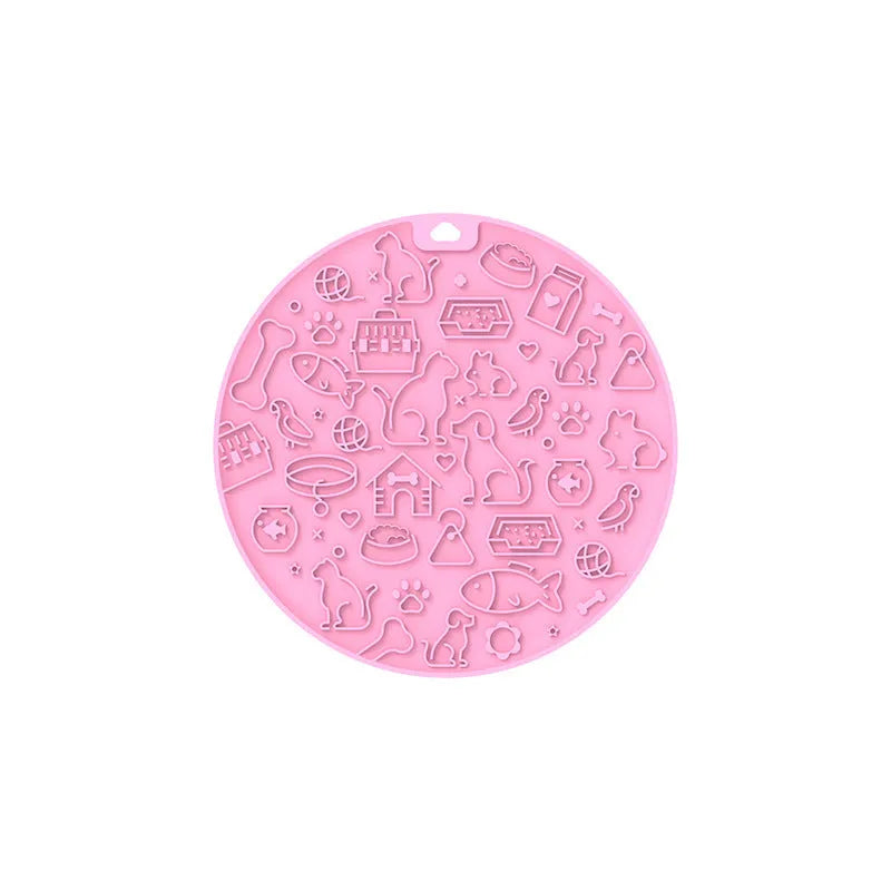 Round blue silicone pet licking mat with textured surface and a clear central suction cup, shown on a tile floor.