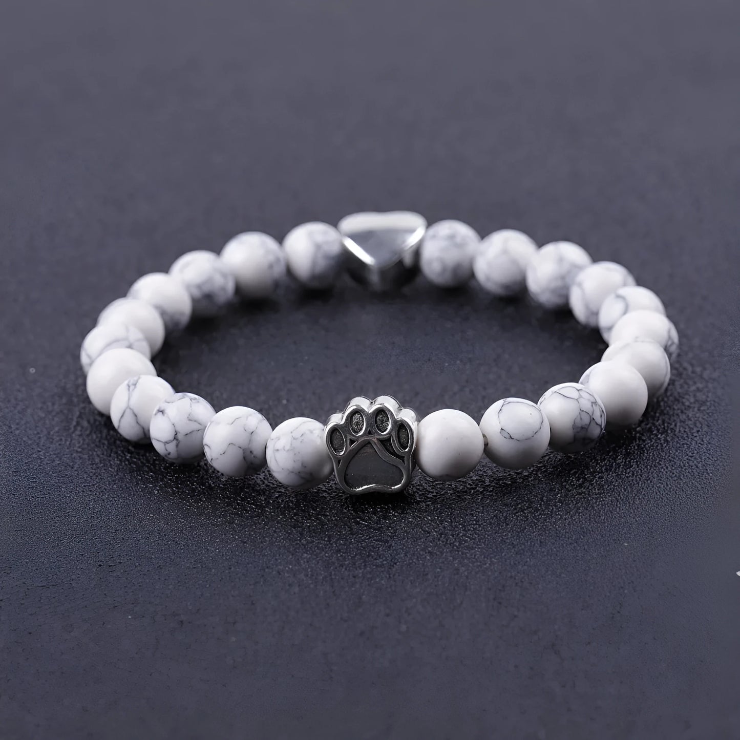 Tiger's eye stone bracelet with dog paw and Indian agate beaded designs on a wrist.
