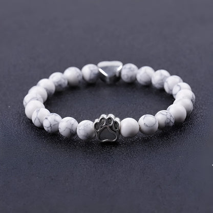 Tiger's eye stone bracelet with dog paw and Indian agate beaded designs on a wrist.