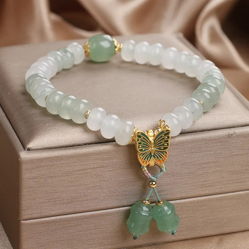 Green crystal abacus beads bracelet with retro butterfly charm and tassel decoration