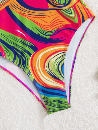 Women's deep V neck one-piece swimsuit with spaghetti straps in printed polyester fabric.
