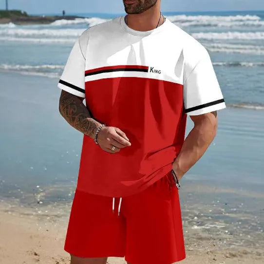 Man wearing a loose fit grey short-sleeved t-shirt and matching shorts from a summer leisure suit.