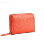 Genuine leather zipper coin purse in a solid colour showing sewing line detail.