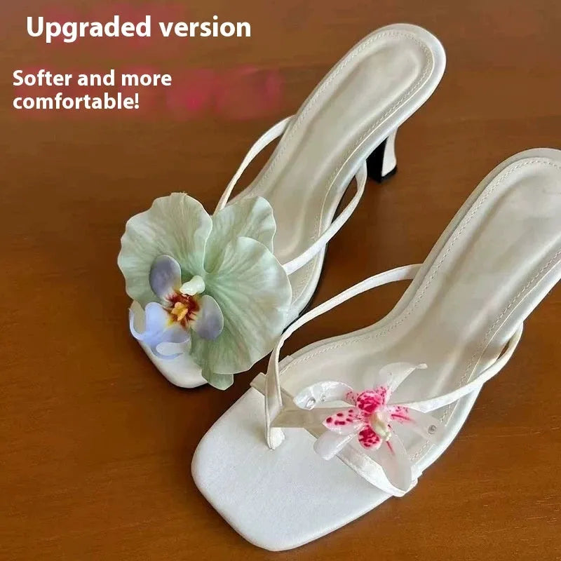 Women's handmade asymmetric flower high heel sandals in black, green, pink, or white on a calf leather upper with EVA sole.