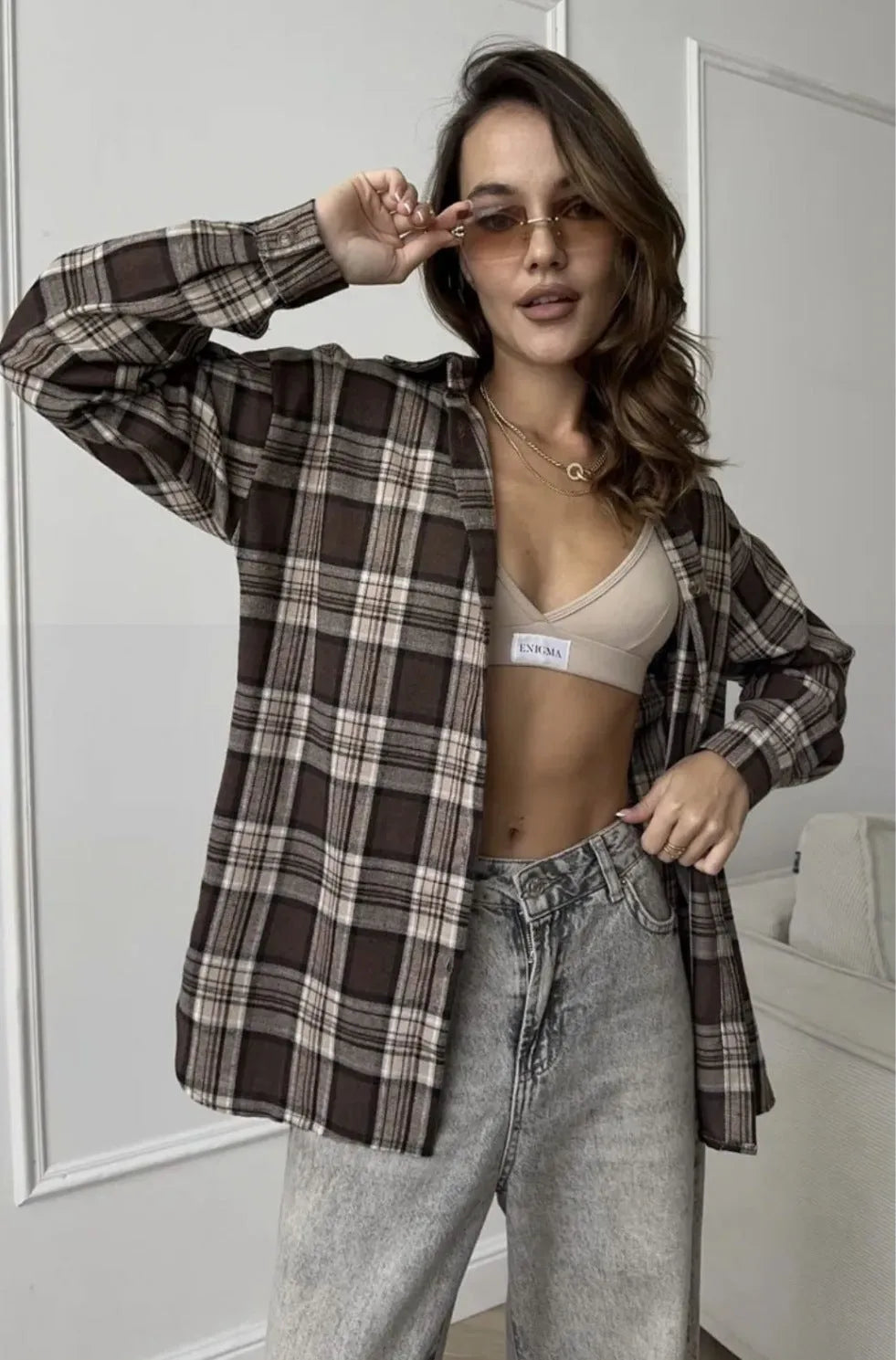 Dark brown striped long sleeve women's shirt with retro collage stitching detail on the front.