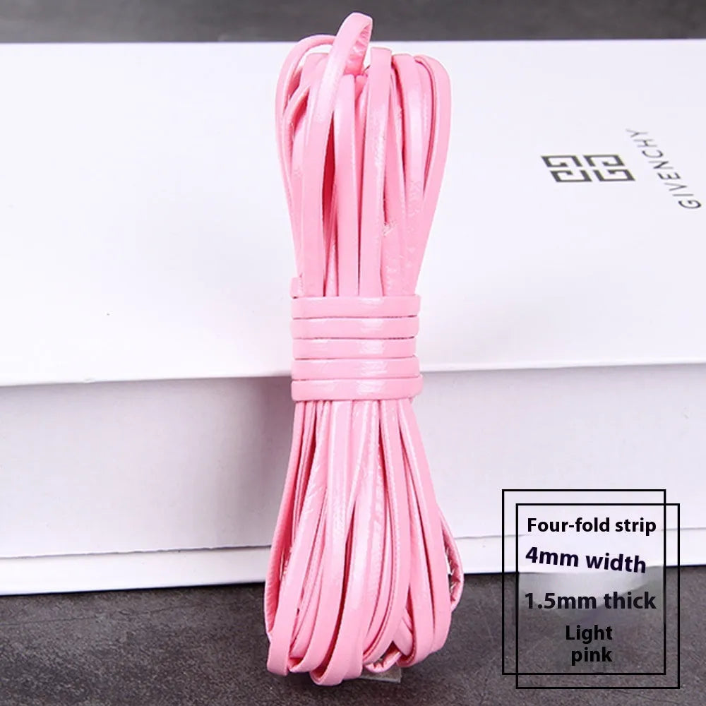 Coiled reels of PU leather craft string in multiple colours including beige, black, red, and blue.