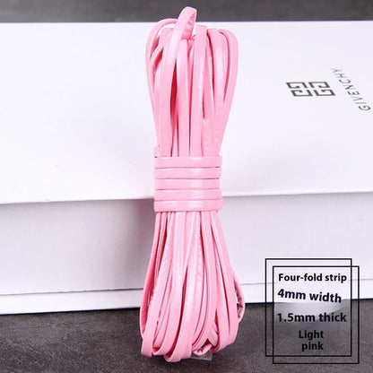 Coiled reels of PU leather craft string in multiple colours including beige, black, red, and blue.