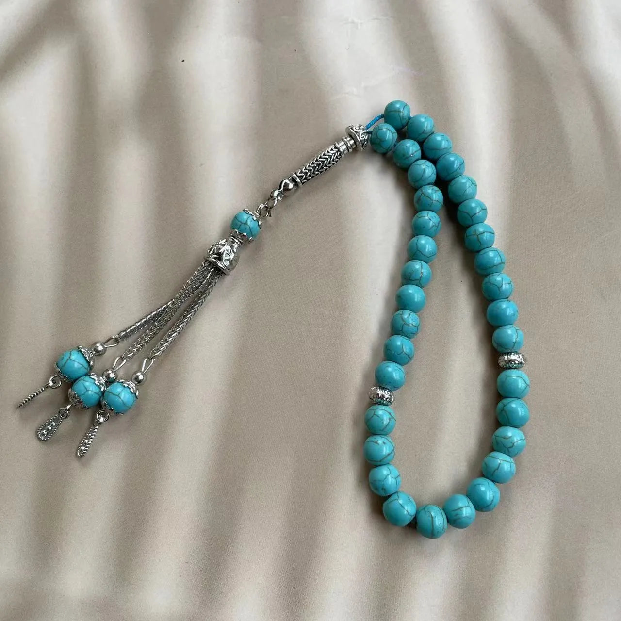Sky blue stone bead Muslim prayer bracelet with 8mm beads on a single strand.