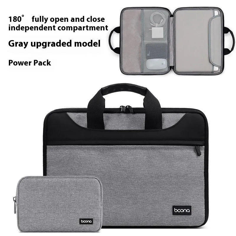 Black Oxford cloth laptop bag fully opened showing main compartment, with soft carry handle.