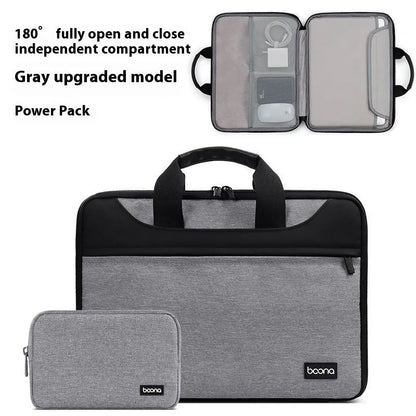 Black Oxford cloth laptop bag fully opened showing main compartment, with soft carry handle.