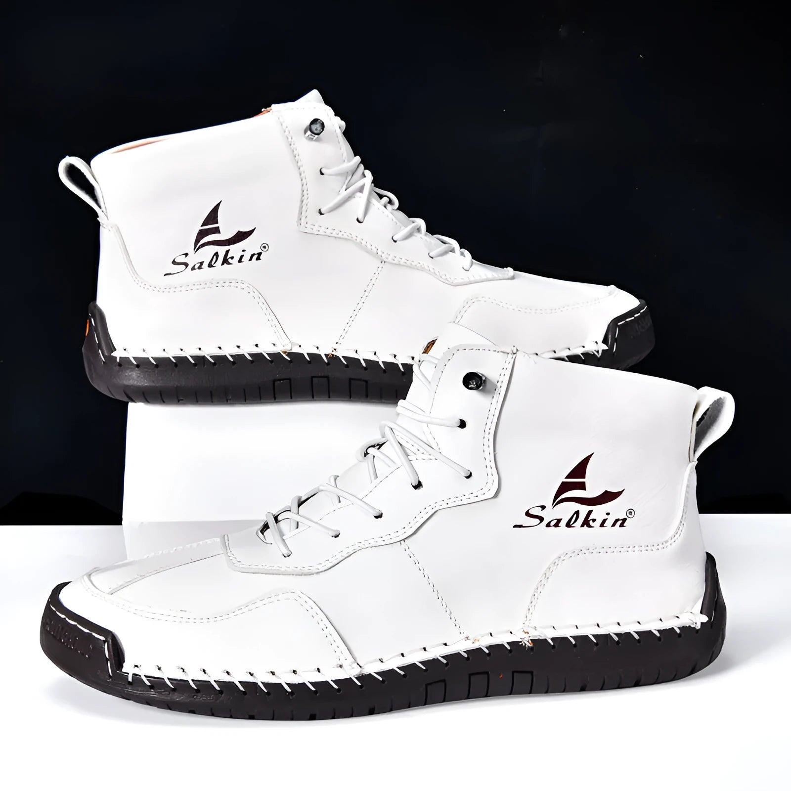 A pair of beige high-top casual boots with elastic band fastening and a flat rubber sole.