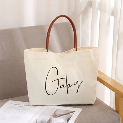 Cotton canvas tote bag shown in beige white and white colour options.