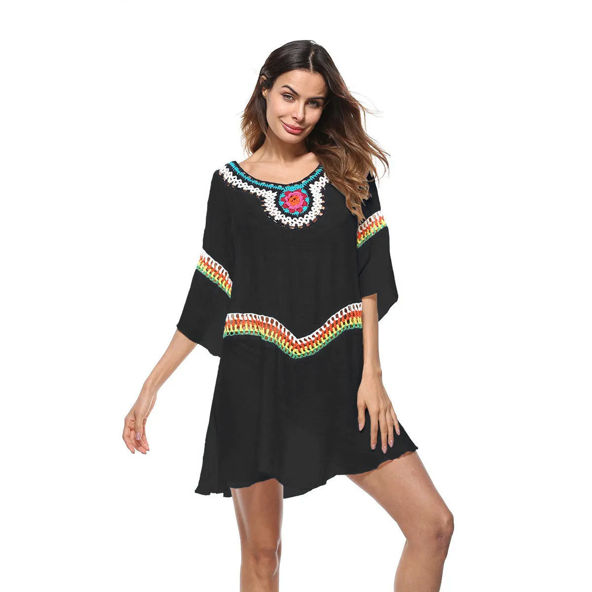 Crocheted white beach cover-up with open-knit design, worn over swimsuit, demonstrating UPF 50+ sun protection.