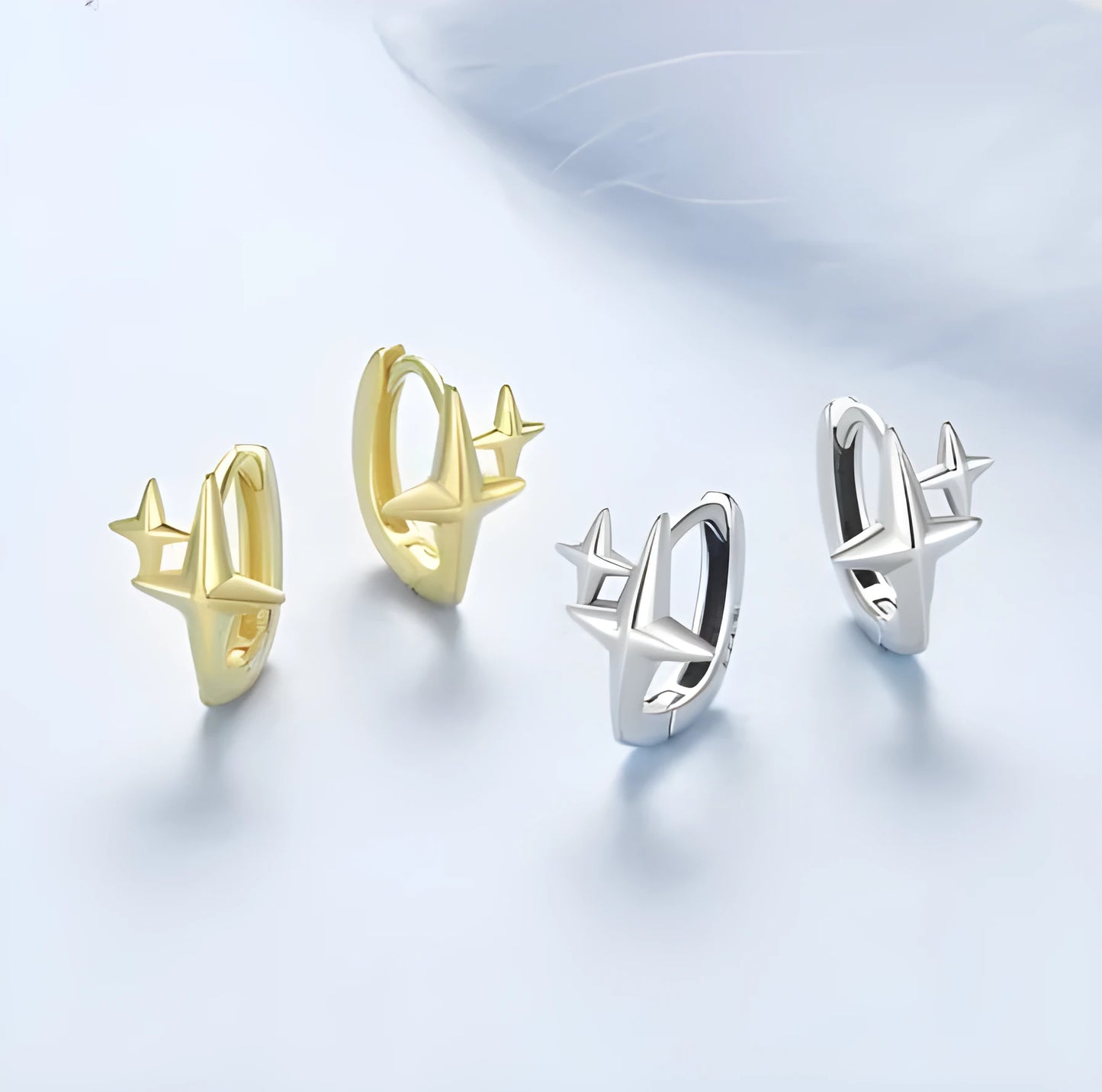 Sterling silver minimalist star ear clip with oxidised finish and XINGX design detail.