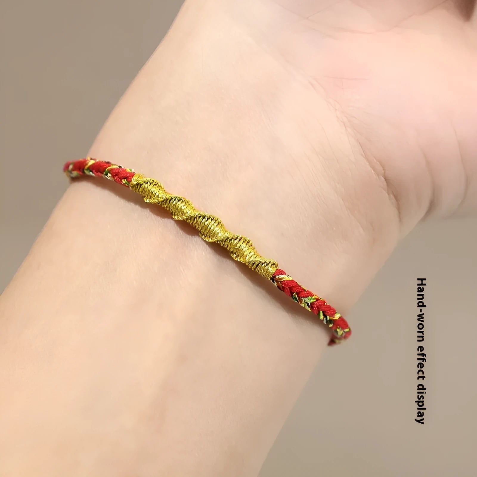 Woven eight-strand hand strap in zodiac-themed colours with flexible wire construction