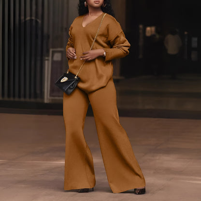 Women's brown suede two-piece suit with split sleeves on top and matching trousers