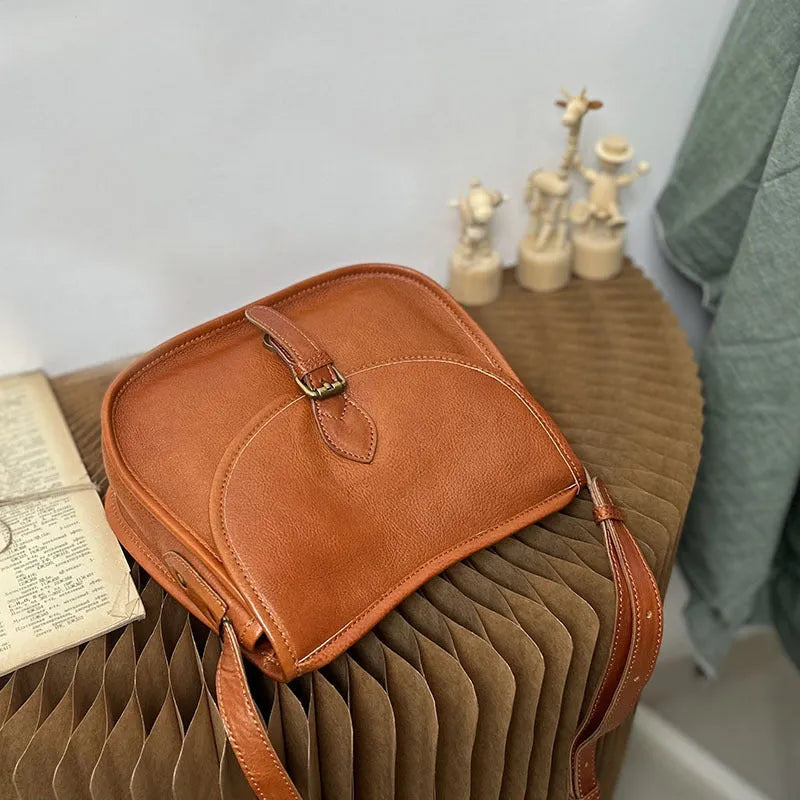Genuine leather retro messenger bag with crossbody strap and flap closure in coffee colour