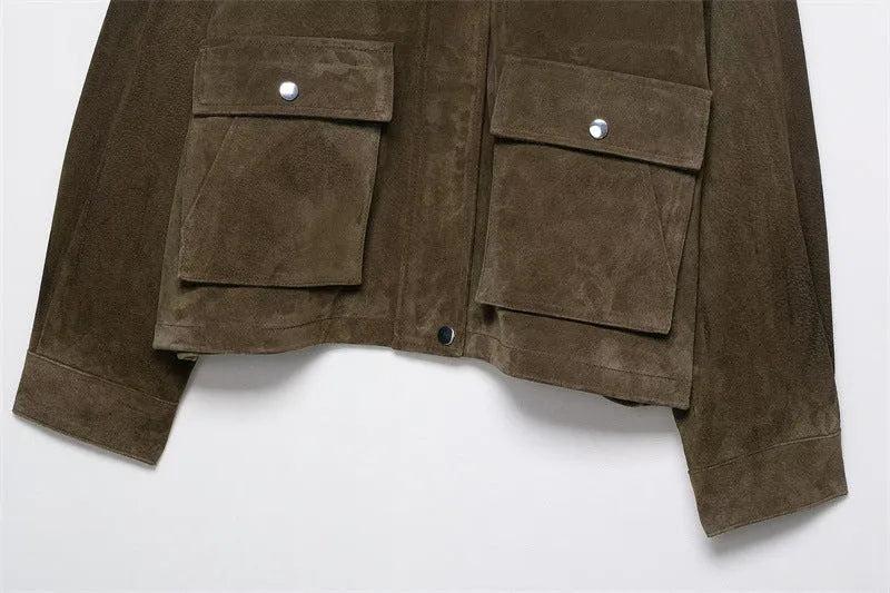 Women's black PU leather-look casual jacket with a relaxed fit, shown on a model.