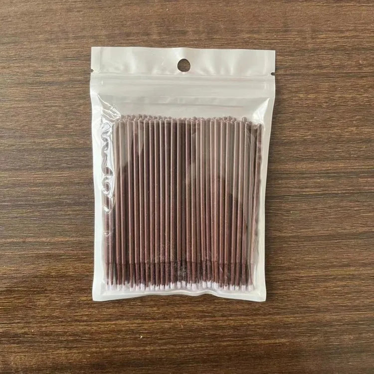 Disposable micro applicator brushes with coloured plastic handles and bendable cotton swab tips