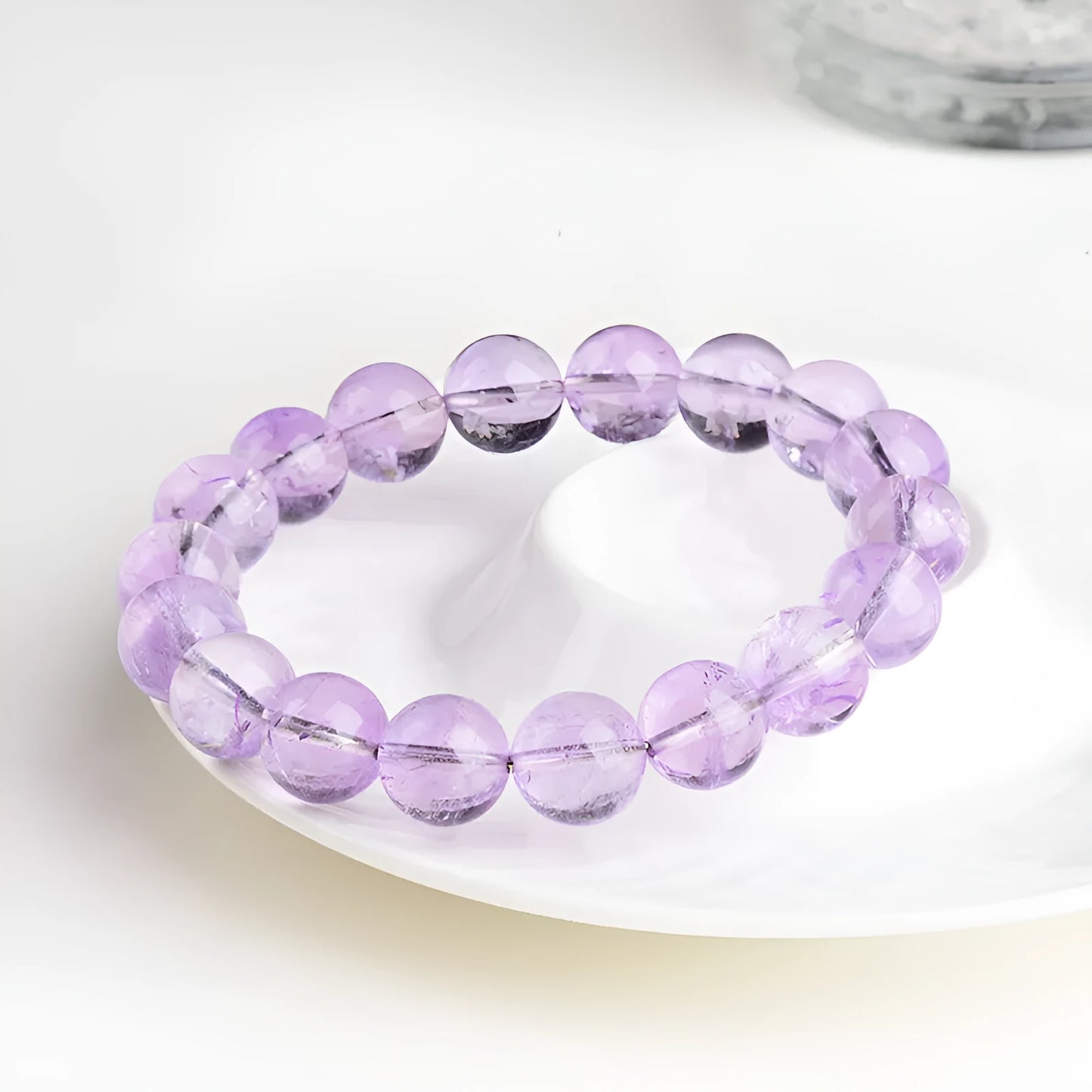 Lavender amethyst bracelet with water ripple design on beads, showing cream body and transparent colour options