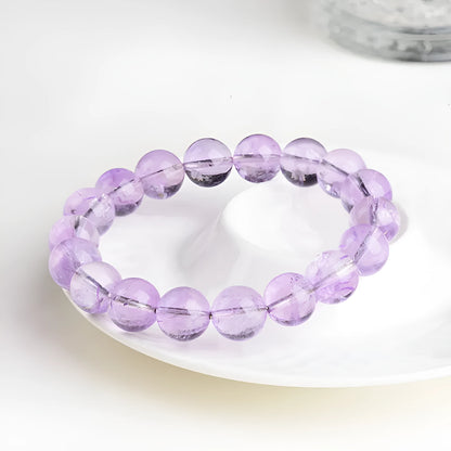 Lavender amethyst bracelet with water ripple design on beads, showing cream body and transparent colour options
