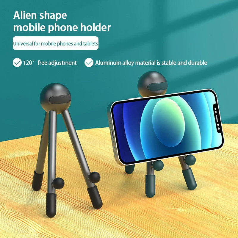 Adjustable desk stand in pink and green alien-inspired designs, featuring a mobile phone and tablet holder with 120-degree angle adjustment