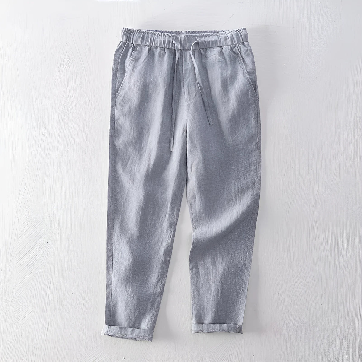 Men's straight linen trousers in four colour options showing mid waist and straight-leg cut