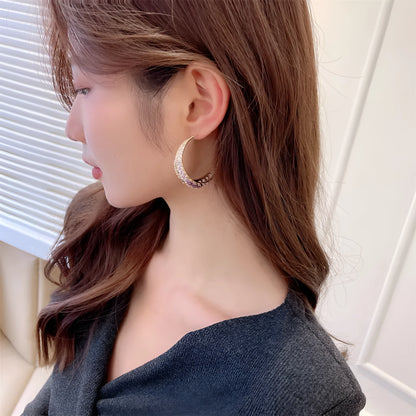 Women's geometric copper hoop earrings in gold white zirconium finish, showing 4.3 cm by 4.5 cm drop shape.
