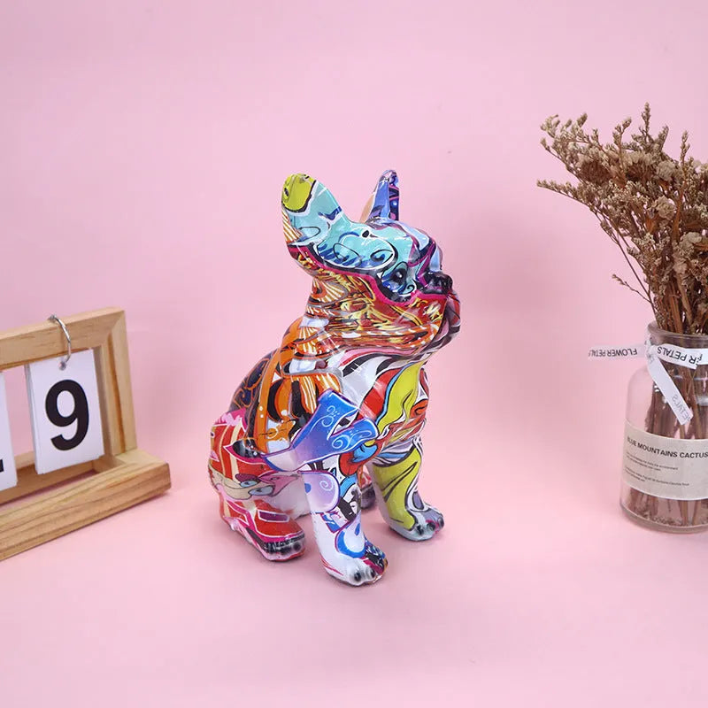 Colourful graffiti-style French bulldog resin statue on a white background