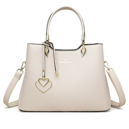 Black women's multi-layer PU leather shoulder messenger bag with sewing thread detail.