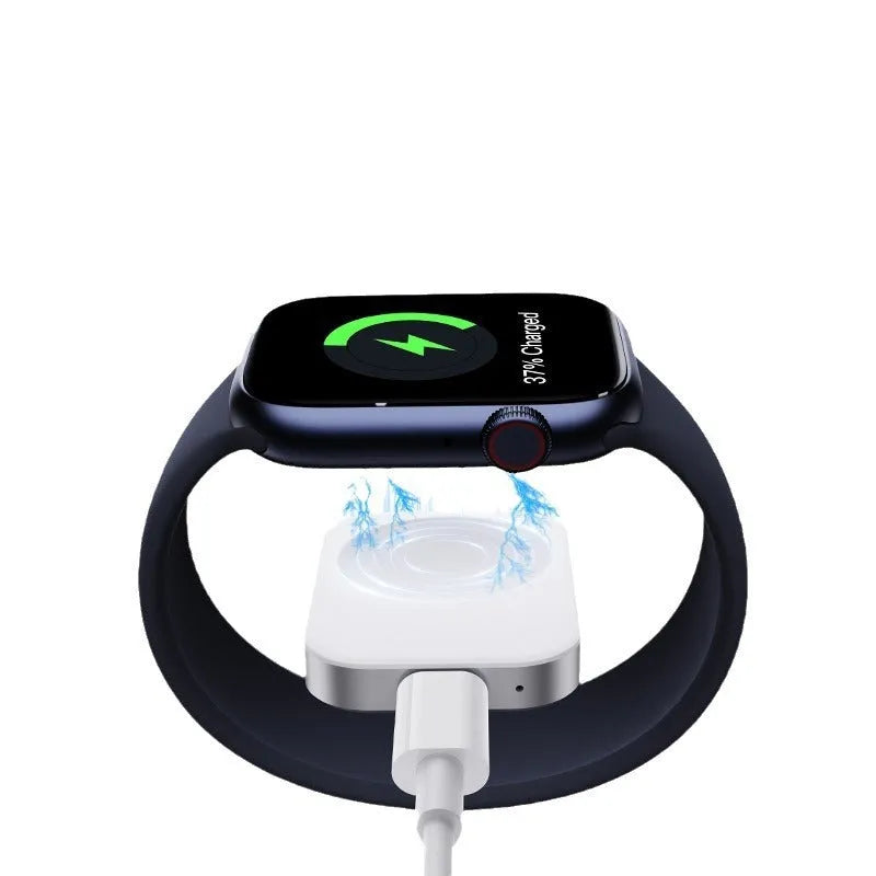Compact black and white 3-in-1 magnetic wireless charger with integrated cables, shown next to a smartphone for scale.