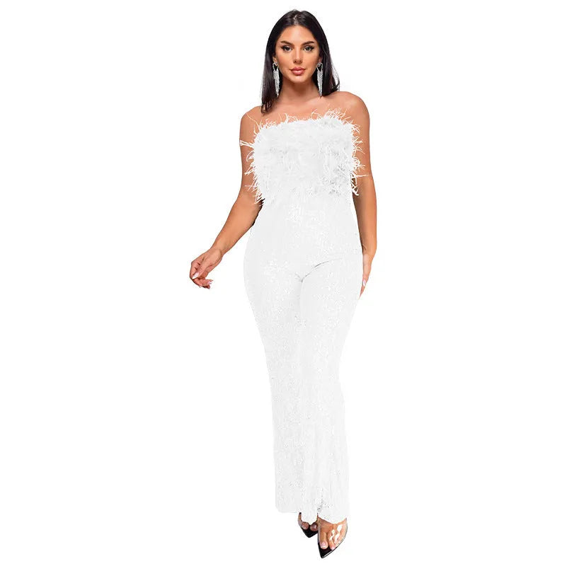Women's sleeveless backless jumpsuit with flared legs in a wine red colour.