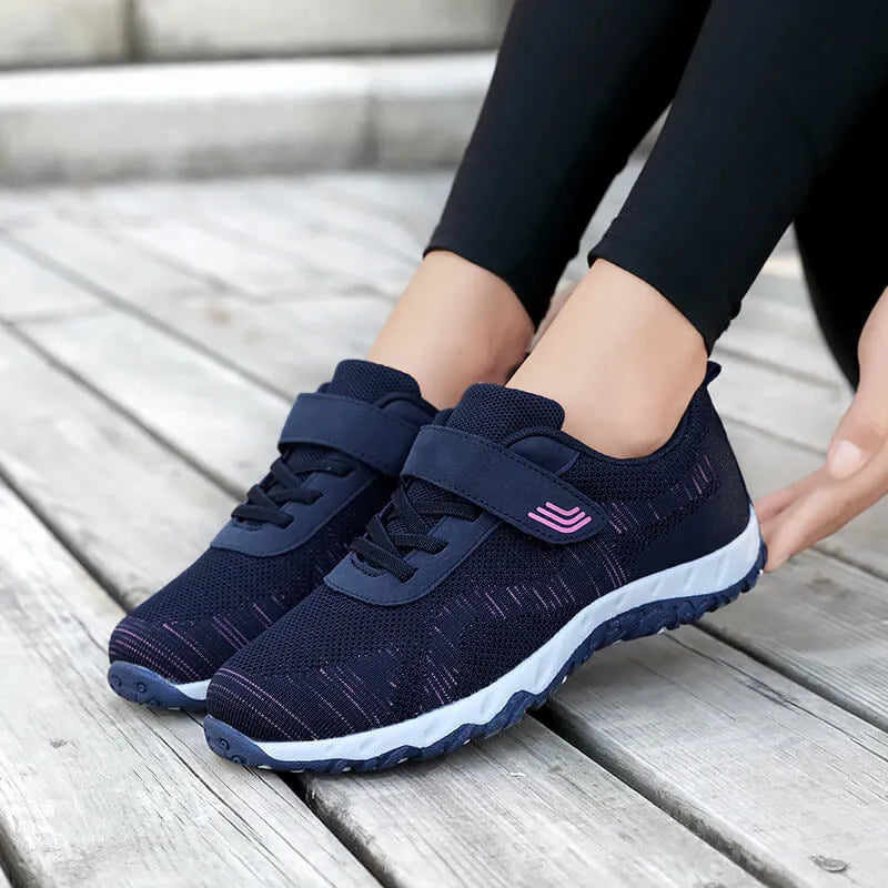Women's gray purple casual shoes with mesh upper, wedge heel, and Velcro strap.