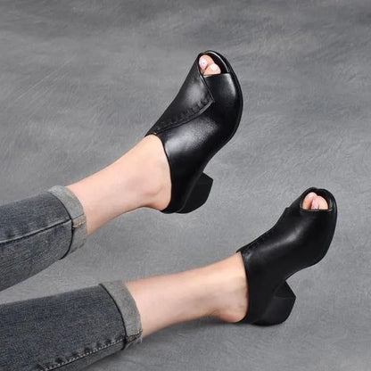 Women's black square heel peep-toe slippers with a rubber sole and fish mouth scaffold design.