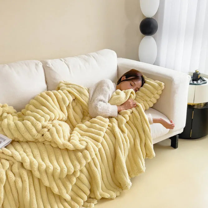 Double-sided bubble velvet faux rabbit fur blanket in a solid colour, shown folded.